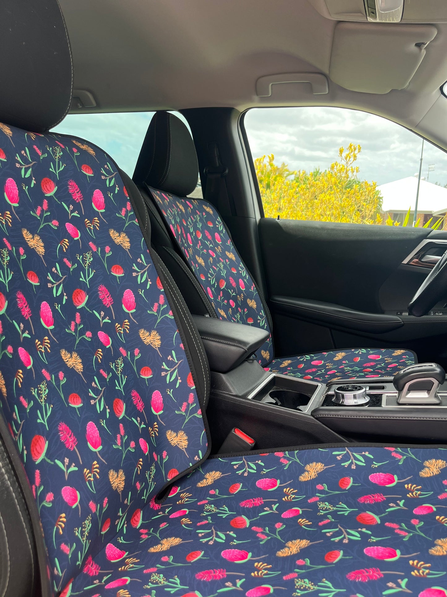 Floral-patterned car seat cover in a vehicle interior
