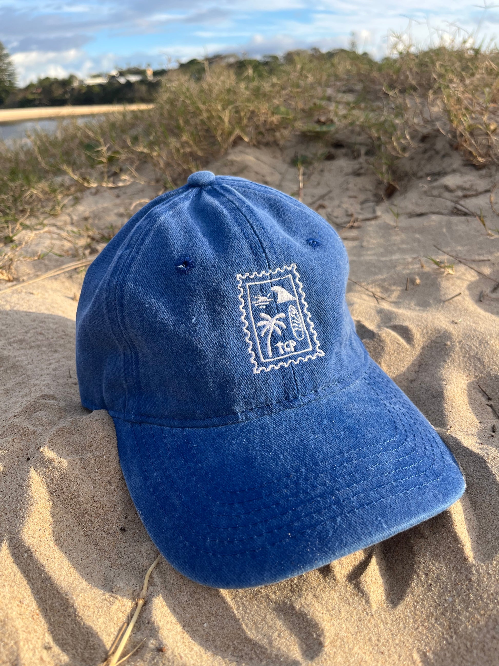 blue cap on sand