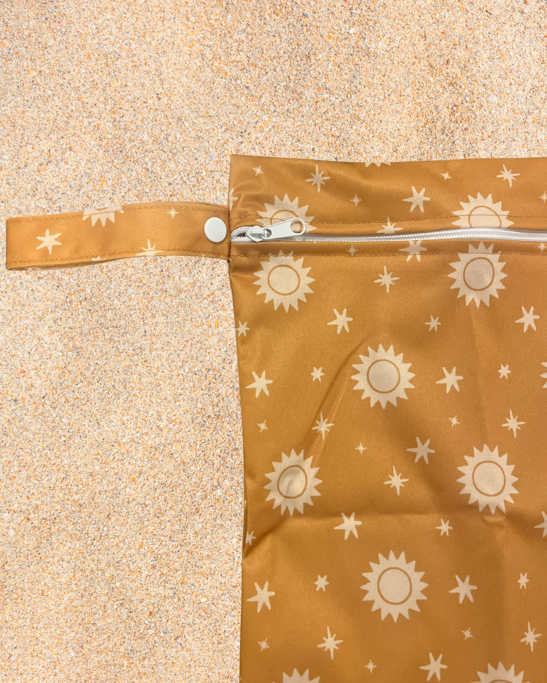 Brown bag with sun pattern on a beige background