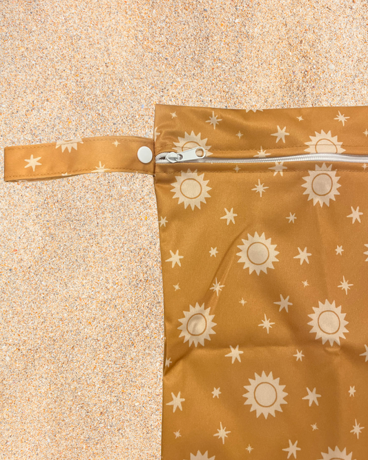 Brown bag with sun pattern on a beige background