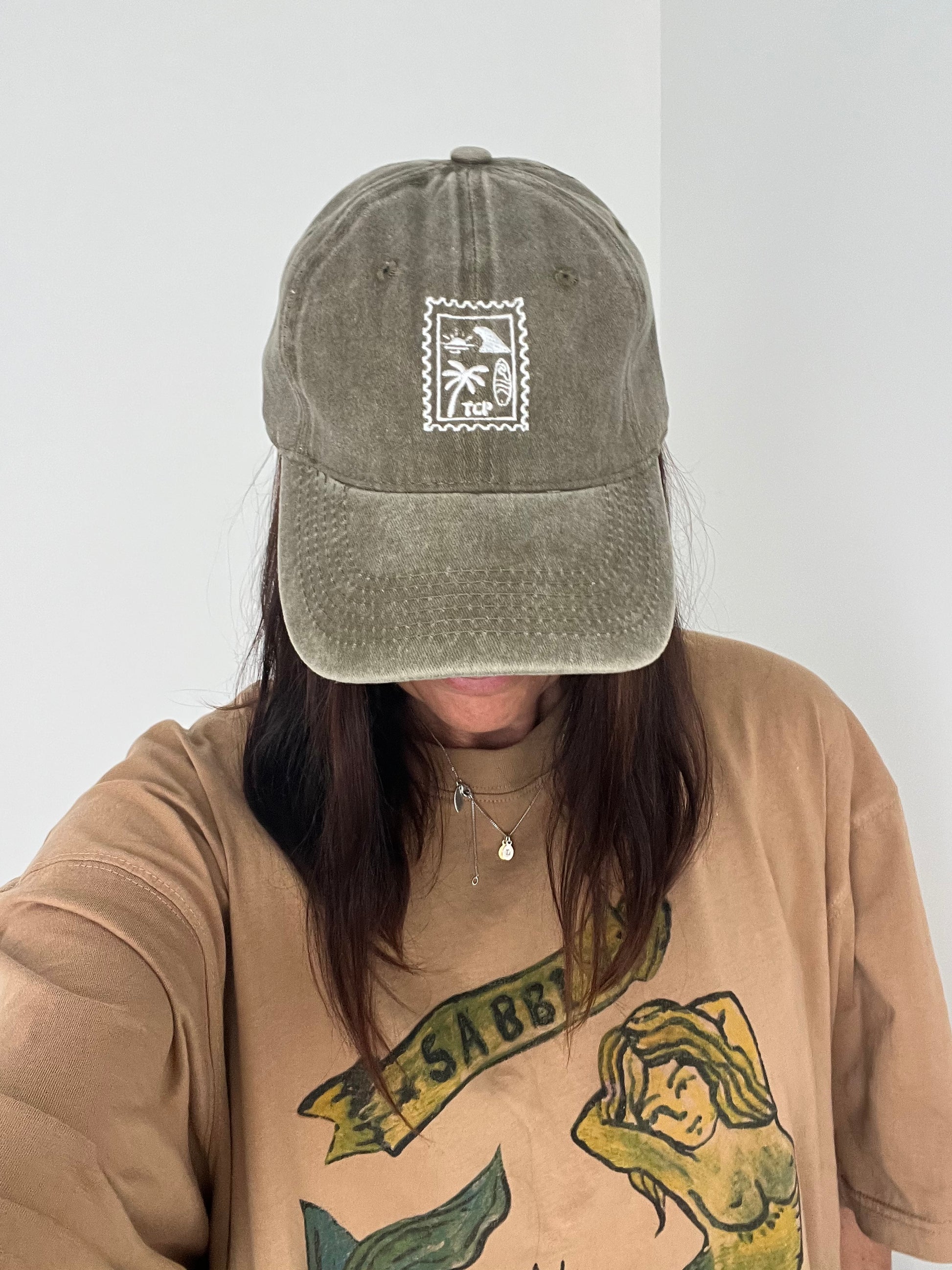 model wearing khaki cap