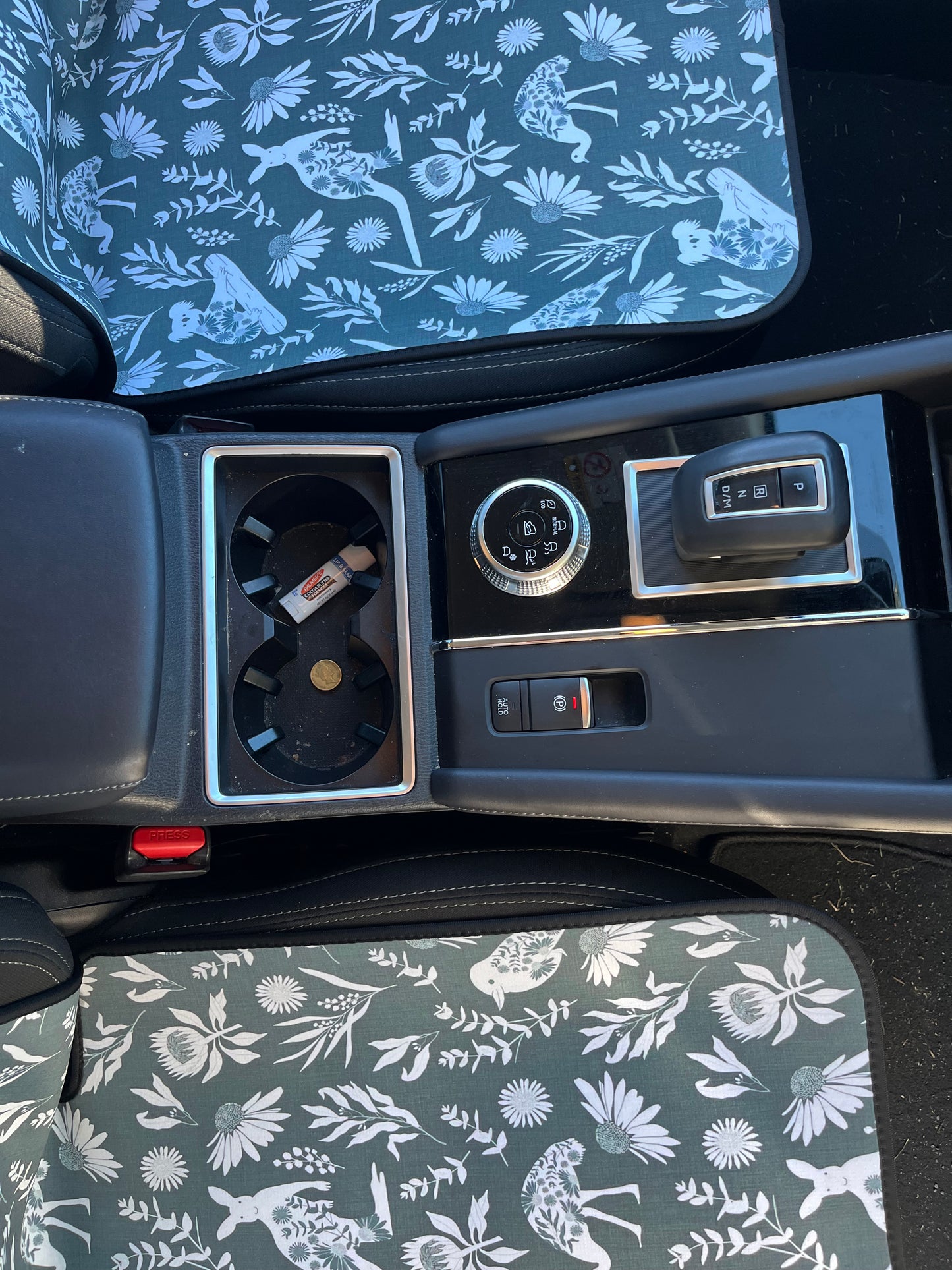 Set of black and white cowboy print Car Seat Cover shown on front car seats. The base view