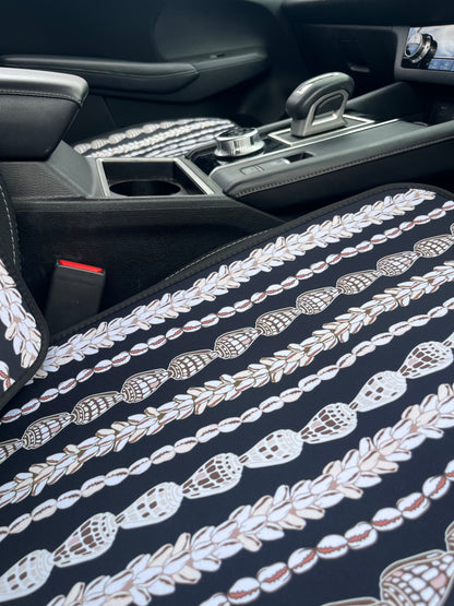 Seashell Lei patterned Car Seat Covers in the car. Black and white in colour