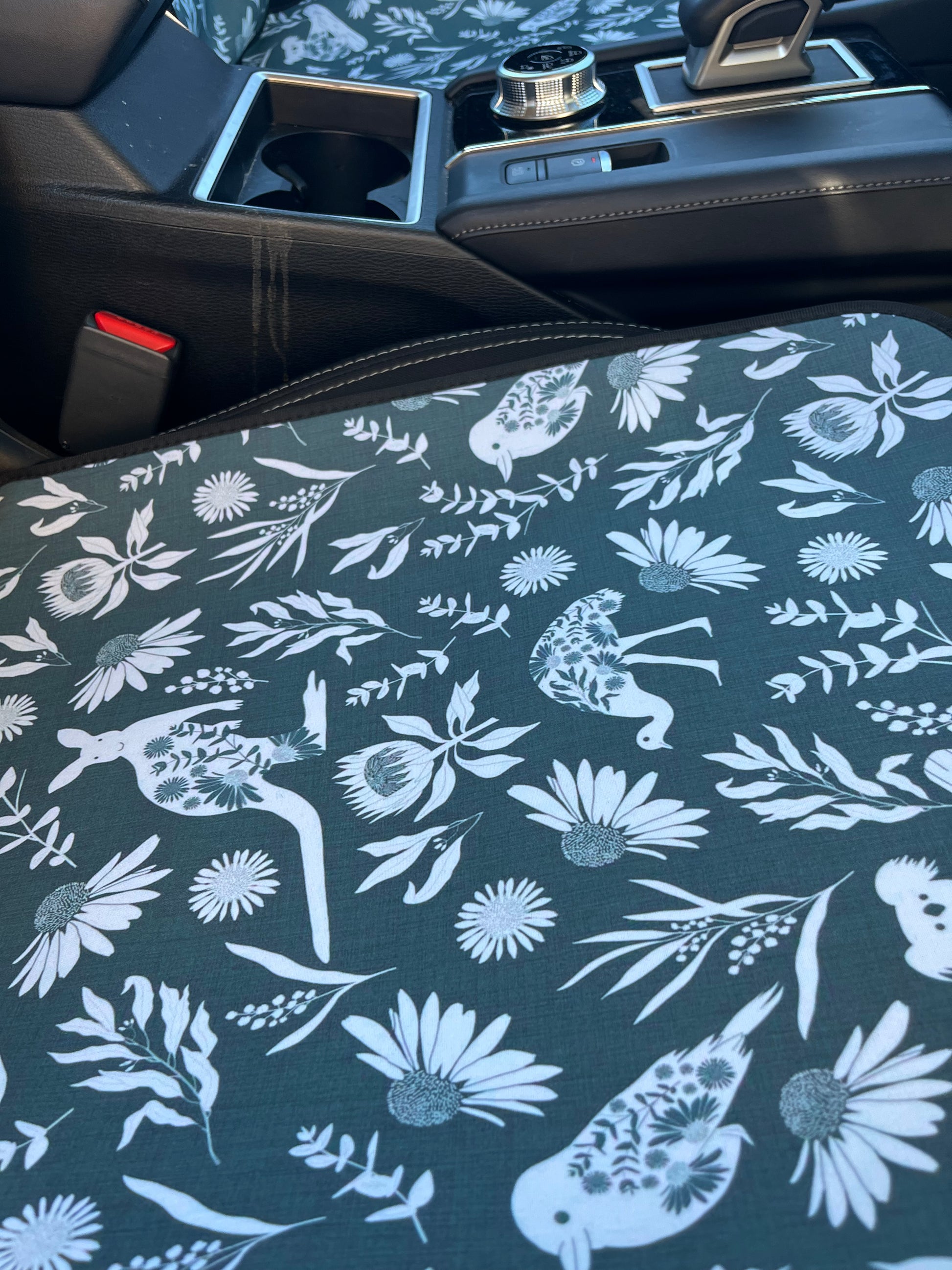 Set of black and white cowboy print Car Seat Cover shown on front car seats. Close up