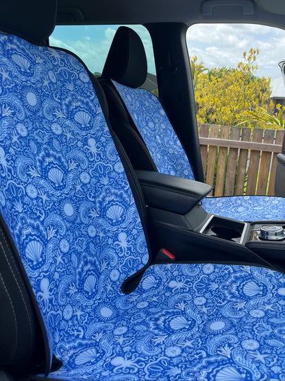 Car interior with blue patterned headliner and side window