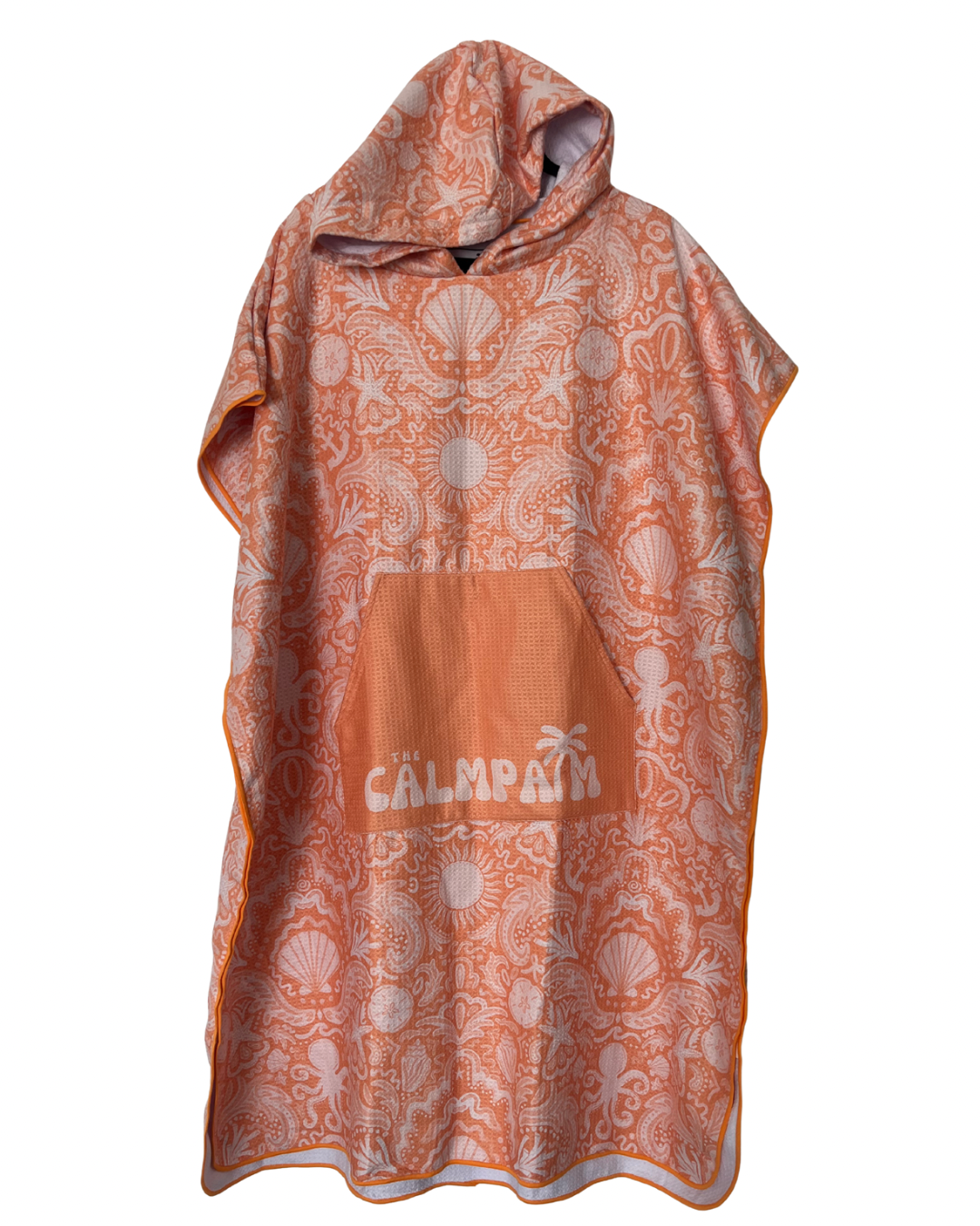 Orange hooded towel with shell pattern and 'the calm palm' branding on a white background