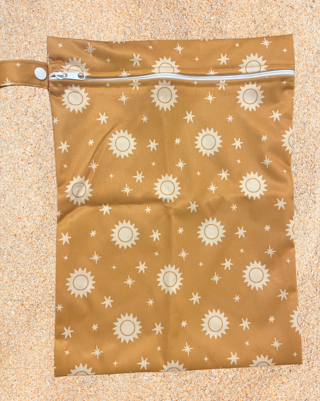 Brown bag with sun and star pattern on a beige background