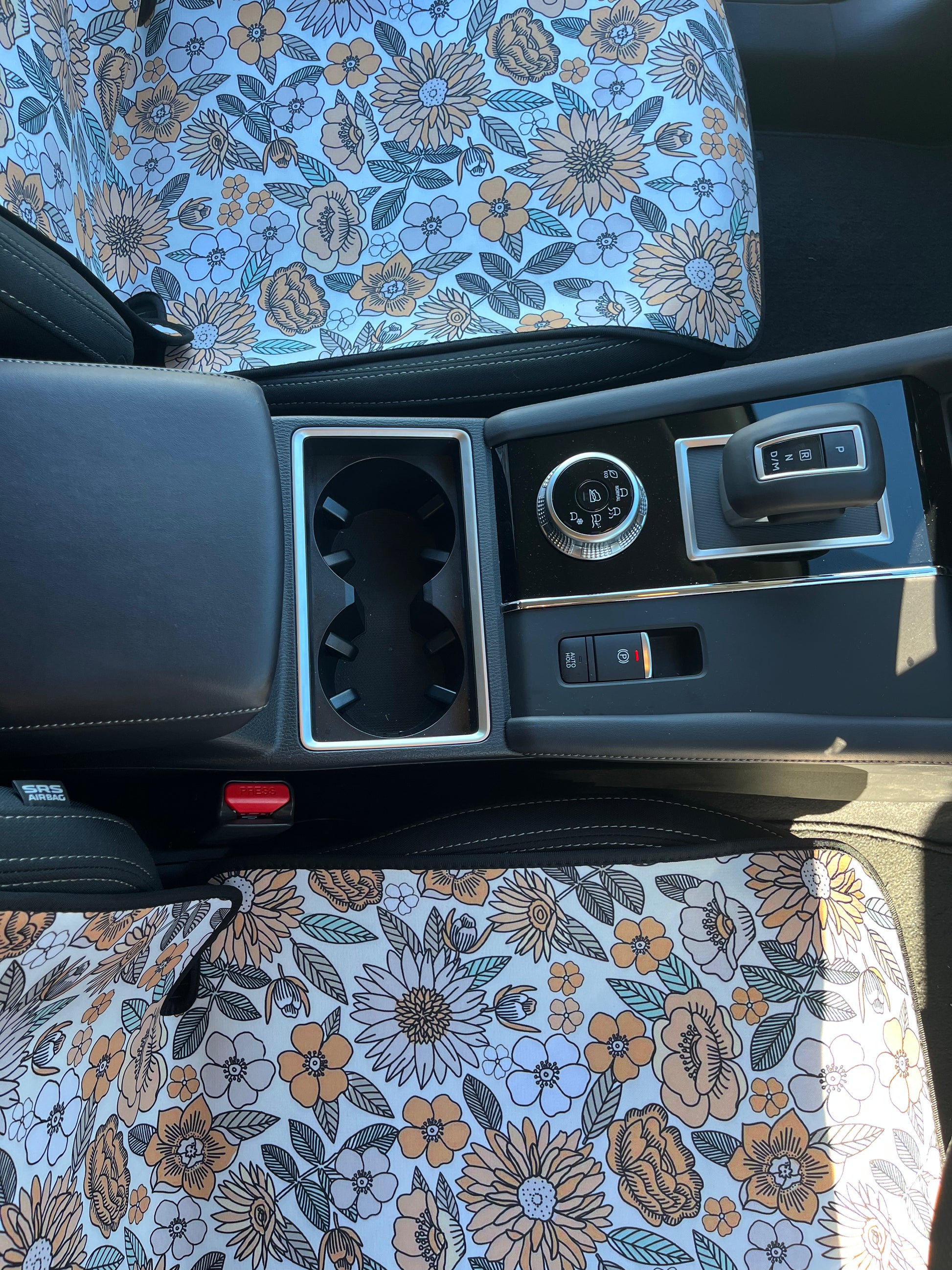 Yellow, green and white floral print on neoprene Car Seat Covers. Shown on the front seats of a car. Easy to install and clean
