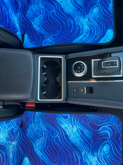 Set of bright blue ocean inspired waterproof Car Seat Covers. Made out of neoprene. Blue tie dye style print that resembles the oceans waves. Base view of covers where you sit