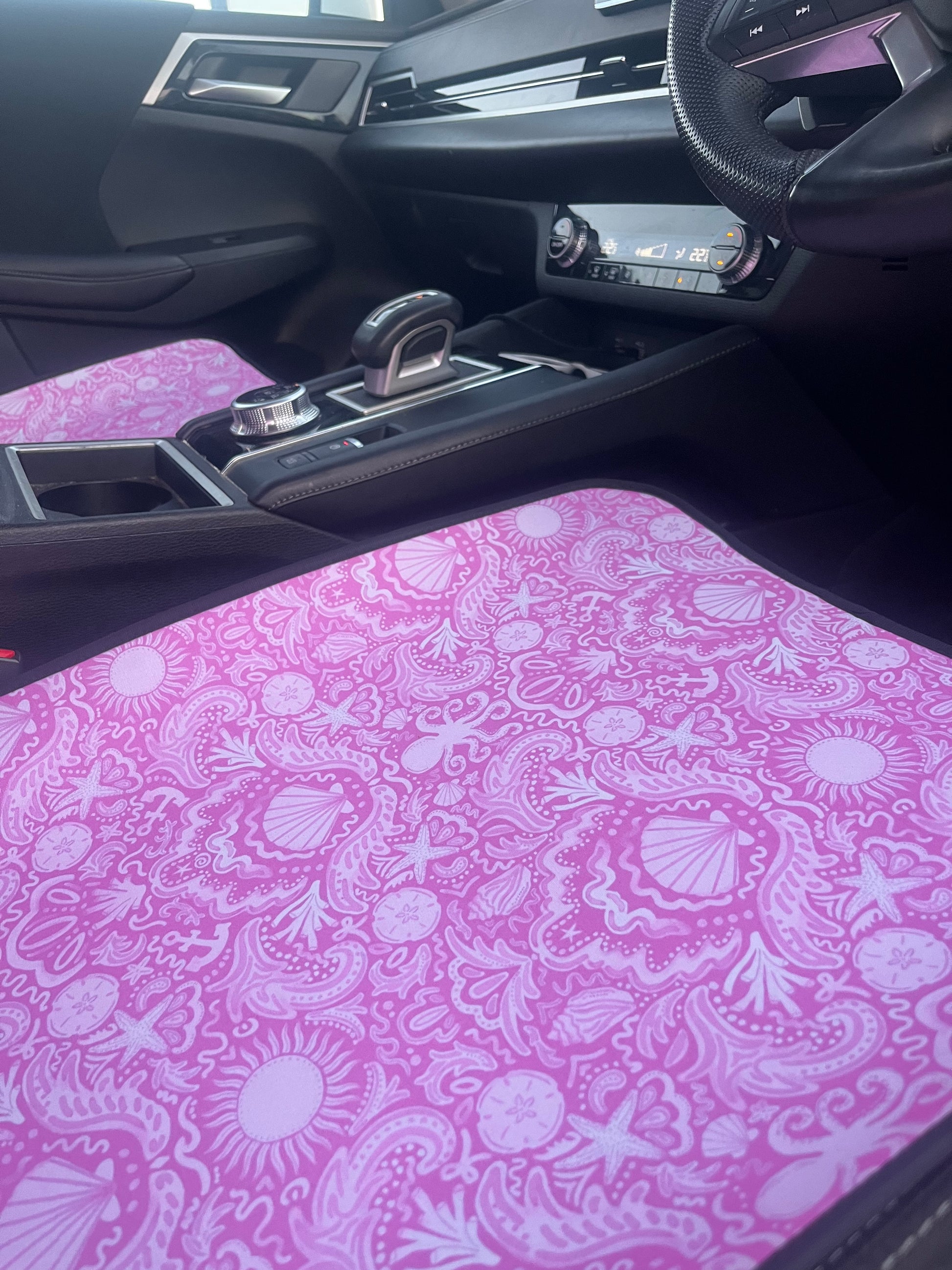 Car interior with a pink patterned fabric background
