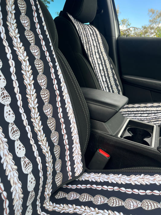 Seashell Lei patterned Car Seat Covers in the car. Black and white in colour