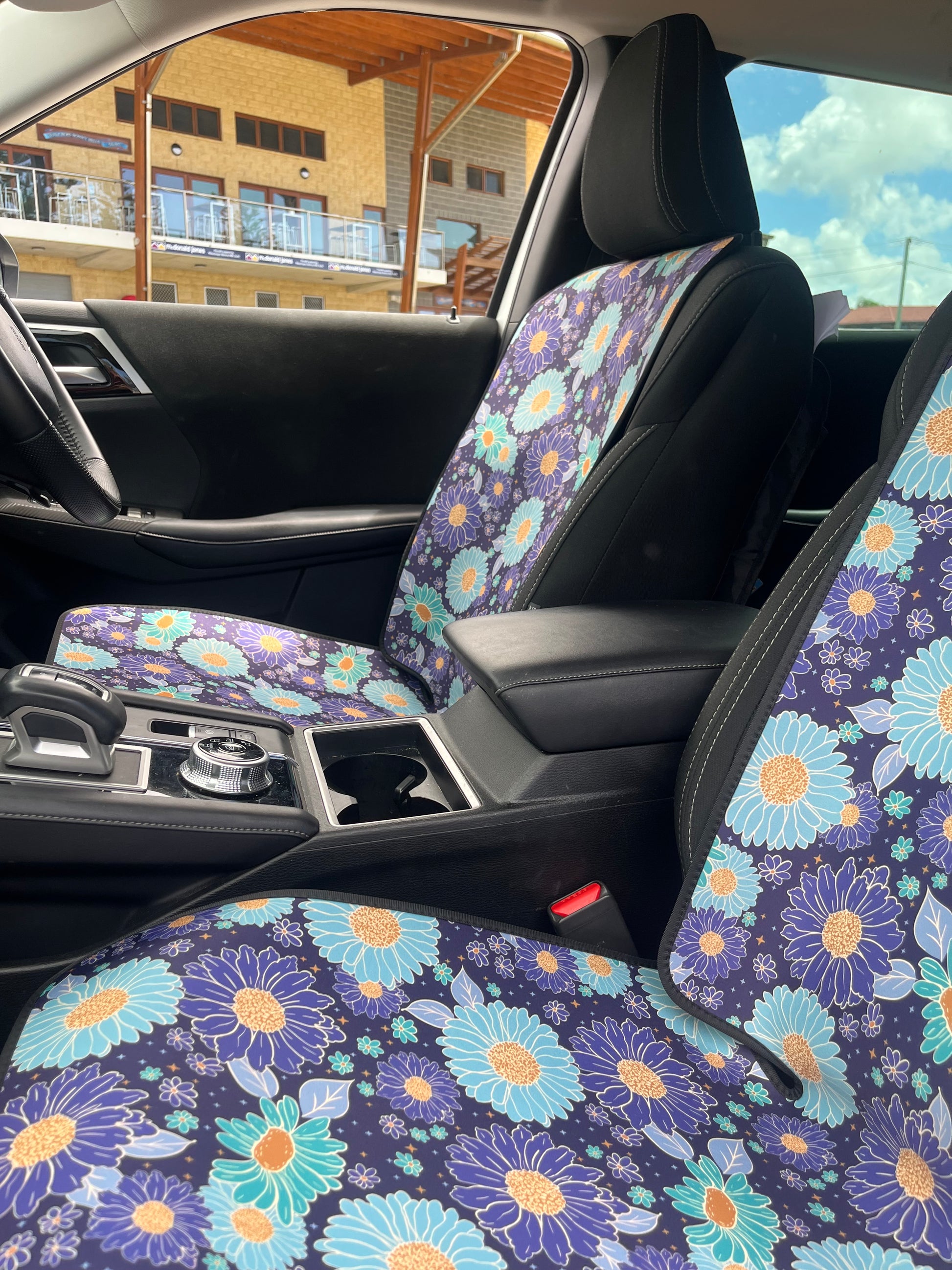 Blue and green floral print Car Seat Covers in the Car at the beach. Easy to install