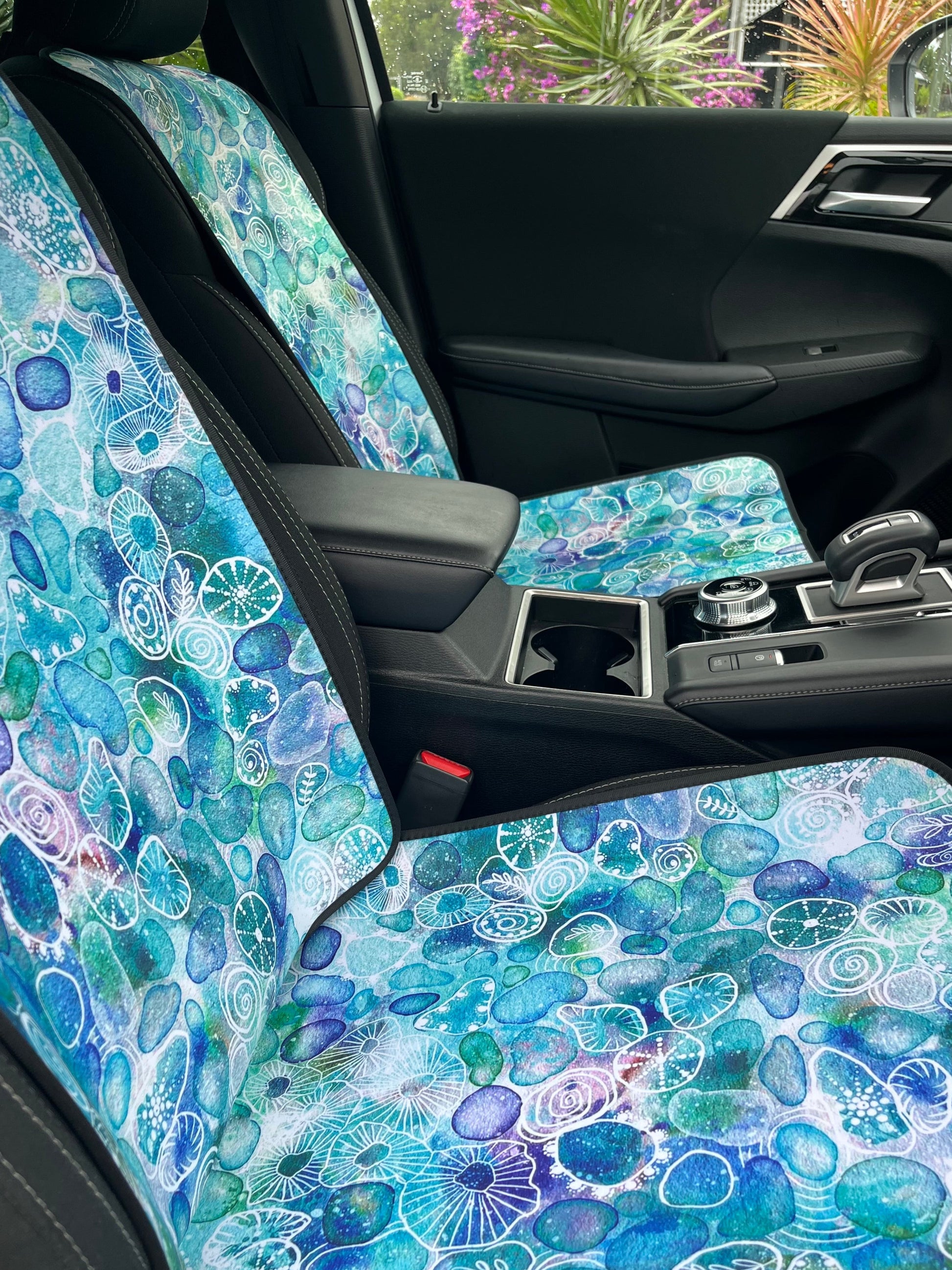 Seaglass print in Aqua tones. Shown on a car seat. Easy to install. Shown in a set on the front car seats