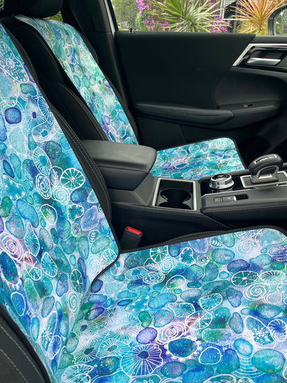 Seaglass print in Aqua tones. Shown on a car seat. Easy to install. Shown in a set on the front car seats