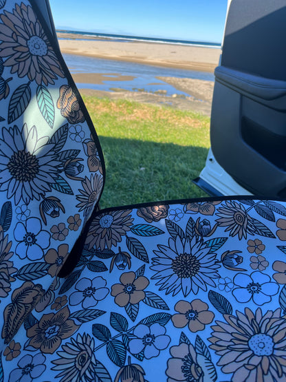 Yellow, green and white floral print on neoprene Car Seat Covers. Shown on the front seats of a car. Easy to install and clean